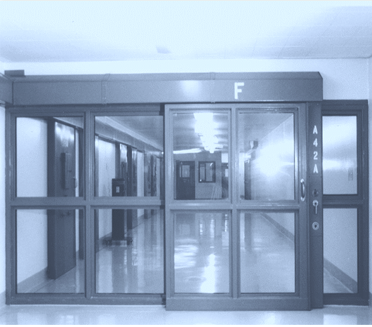 Sliding Door to a Prison Corridor